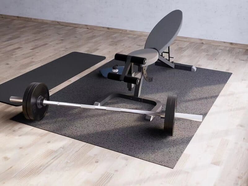 An engineer examining a cross-section of gym flooring material